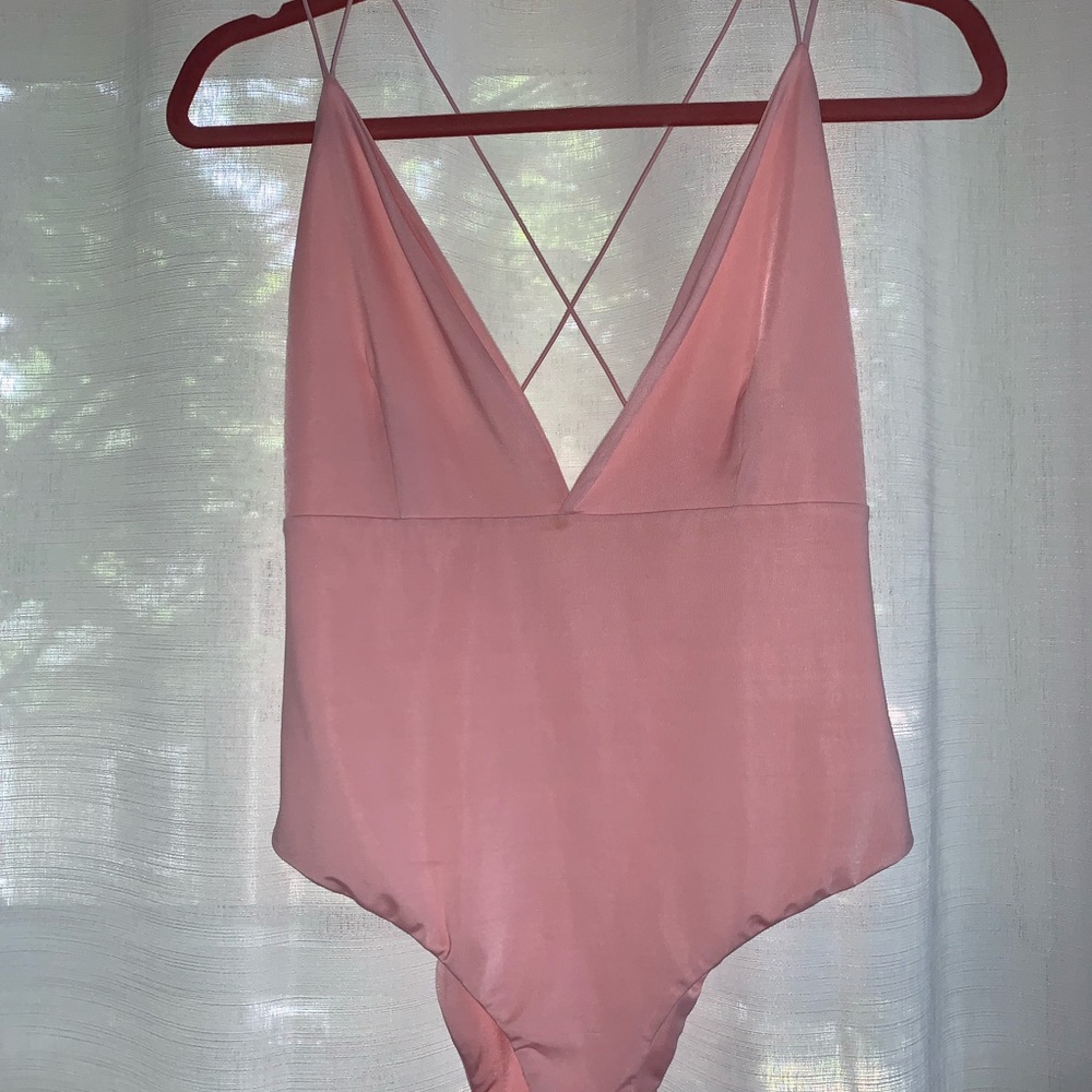 Pink body suit